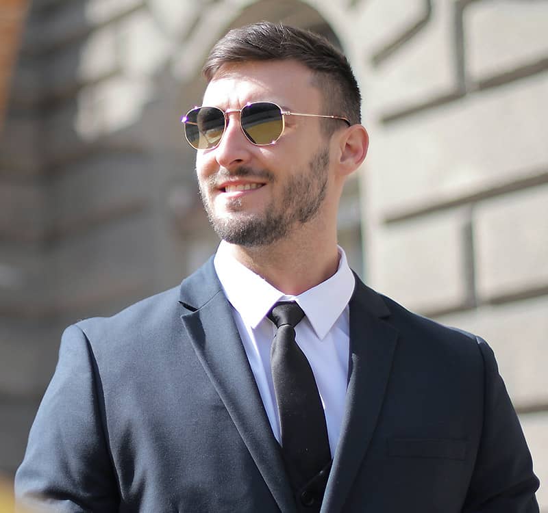 Man Wearing Sunglasses and a Suit